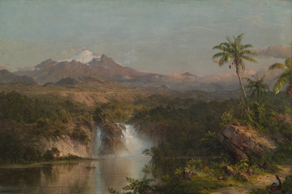 A vast volcanic peak rising above a green valley, its flanks catching the last of the light.